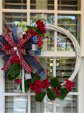 Patriotic Red Floral Wreath with Blue Ribbon Accent